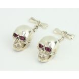 A pair of silver skull cufflinks, 13 grams