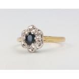 An 18ct yellow gold sapphire and diamond cluster ring size N 1/2