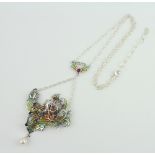 A silver Art Nouveau style portrait necklace set with amethyst, cabochon ruby, ruby, marcasite and