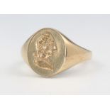 A gentleman's 9ct yellow gold signet ring cut with a portrait bust of a gentleman, size R, 10.6