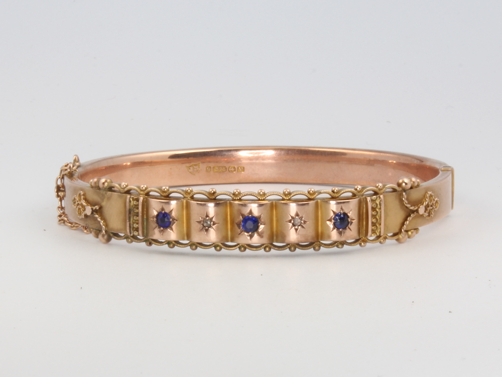 A Victorian 9ct yellow gold amethyst and diamond etruscan style bangle, 11 gramsThere is some