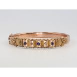 A Victorian 9ct yellow gold amethyst and diamond etruscan style bangle, 11 gramsThere is some