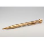 A 9ct yellow gold engine turned propelling pencil, gross 15.4 grams