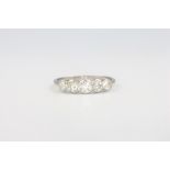 A platinum 5 stone diamond ring, approx. 0.75ct, size N