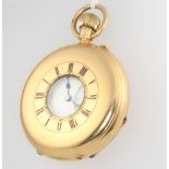 A gentleman's 18ct yellow gold half hunter pocket watch contained in a 50mm case This watch is in