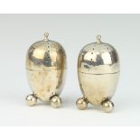 A pair of Edwardian silver ovoid condiments Birmingham 1907, 6.5cm, 66 grams