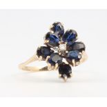 A 14ct yellow gold sapphire and diamond cluster ring, 2.8 grams, size M 1/2