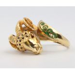 An 18ct enamelled yellow gold rams head ring size L 1/2, 10.1 grams