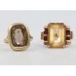 A 9ct yellow gold smoky quartz ring size G, an Art Deco style ditto size M 1/2, 6.9 grams
