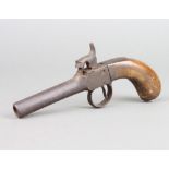 A 19th Century percussion pocket pistol, the 8cm barrel with crossed swords proof mark The spring
