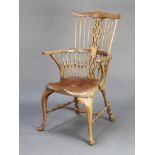 A heavily bleached mahogany Georgian style stick and rail back carver chair, raised on cabriole