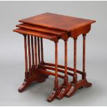A nest of 3 rectangular Georgian style crossbanded mahogany interfitting coffee tables on turned