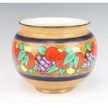 An Art Deco porcelain jardiniere decorated with stylised fruits 31cm