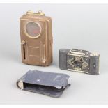 An Ensign Midget folding camera together with a military issue signalling torch, the back marked D.B