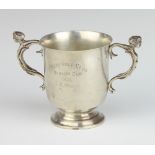 An Indian silver 2 handled presentation trophy with caryatid handles and presentation inscription