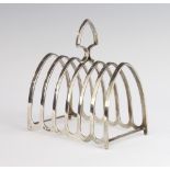 A silver 7 bar arched toast rack Birmingham 1927, 147 grams, 11cm