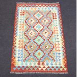 A yellow, green and tan ground Chobi Kilim rug 156cm x 100cm