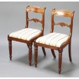 A pair of Georgian mahogany bar back dining chairs with shaped mid rails and drop in seats, raised