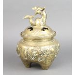 A Chinese polished bronze censer with dragon finial raised on 3 stub supports 24cm h x 17cm
