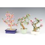 Three modern Chinese coloured glass floral displays