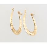 A pair of 9ct yellow gold engraved hoop earrings, 1 gram These earrings are in good condition and