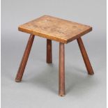 A 19th Century rectangular elm rustic stool raised on outswept supports 32cm h x 33cm w x 26cm d
