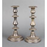 A pair of silver plated waisted candlesticks 23cm