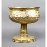 A Victorian oval embossed brass pedestal bowl raised on an oval foot 31cm x 30cm x 26cm
