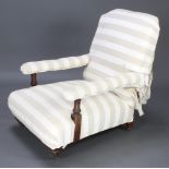 Maple & Co, a Victorian open arm chair, part upholstered in white material The upholstery to the