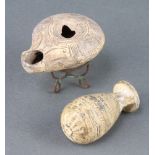 A Roman style pottery oil lamp 2cm x 7cm x 6cm together with a ditto club shaped vase 6cm x 3cm