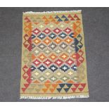 A tan, green and black ground Maimana Kilim rug 90cm x 63cm