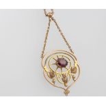 A 9ct yellow gold garnet pendant and chain 4.1 grams