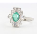 A platinum emerald and diamond cluster ring, the emerald approx. 0.75ct, diamonds 0.6ct, size P, 4.6