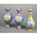 A pair of blue ground floral patterned cloisonne enamelled vases 13cm x 4cm and 1 other 12cm x 3cm