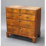 A Queen Anne walnut chest of 2 short and 3 long drawers with brass swan neck drop handles, having