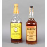 A bottle of Old Crow whiskey together (flecks in bottle) together with a 40fl oz bottle of Old
