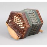 A 19th Century rosewood concertina with 33 buttons Both sides have splits to the fretting and a