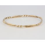 A 9ct yellow gold twist bangle, 13.9 grams