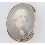 A 19th Century painted oval miniature necklace clasp decorated with a portrait of a gentleman