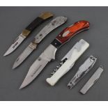 A Winchester folding pocket knife with 8cm blade, steel and mahogany grip, an Explorer ditto