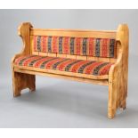 A Victorian style pine settle with upholstered seat and back 97cm h x 145cm w x 49cm d