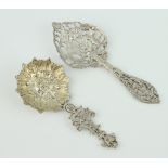 A Continental pierced silver spoon with mask bowl and pierced handle, a ditto sifter spoon, 54 grams