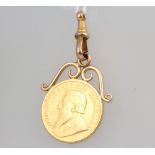 A gold one pond 1896 contained on a 9ct clasp 10.1 grams gross