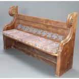 A Victorian Gothic style carved and pierced pine pew with raised back 203cm h x 164cm w x 44cm d