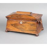 A Victorian rosewood twin compartment tea caddy of sarcophagus form, interior with associated