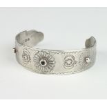 A Victorian silver bangle with chased decoration Exeter 1859 maker John Stone, 28 grams