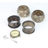 A silver napkin ring London 1914, 3 others, a spoon and wristwatch, weighable silver 84 grams