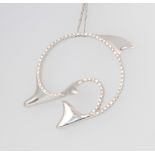 An 18ct white gold and diamond dolphin pendant and chain 16.1 grams