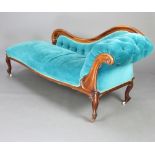 A Victorian rosewood show frame chaise longue upholstered in blue material, raised on cabriole