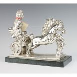 A Continental filled silver figure of a charioteer raised on a green marble base 26cm